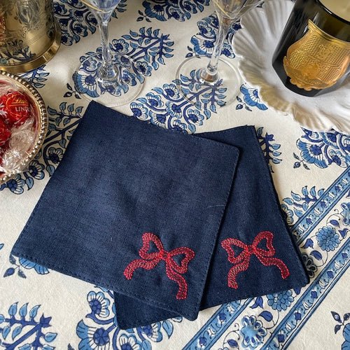 The Voyage Dubai - Red Tie Cocktail Napkins in Navy A classic navy and white pairing with beautifully embroidered bow motifs. Great for any season, perfect for Christmas! Our cocktail napkins are handcrafted from 100% European linen that has been stonewashed and softened giving them a wonderful, luxurious feel. The cocktail napkins come beautifully presented making for the perfect gift.