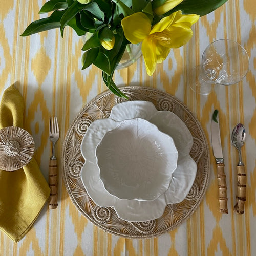 Mallorcan Ikat Tablecloth in Buttercup. A striking cotton blend tablecloth printed in this traditional geometric motif reflective of the easy Mediterranean lifestyle. Perfect for long lunches and alfresco dining.  Origin: Spain Made by hand locally  Also available in other colours.