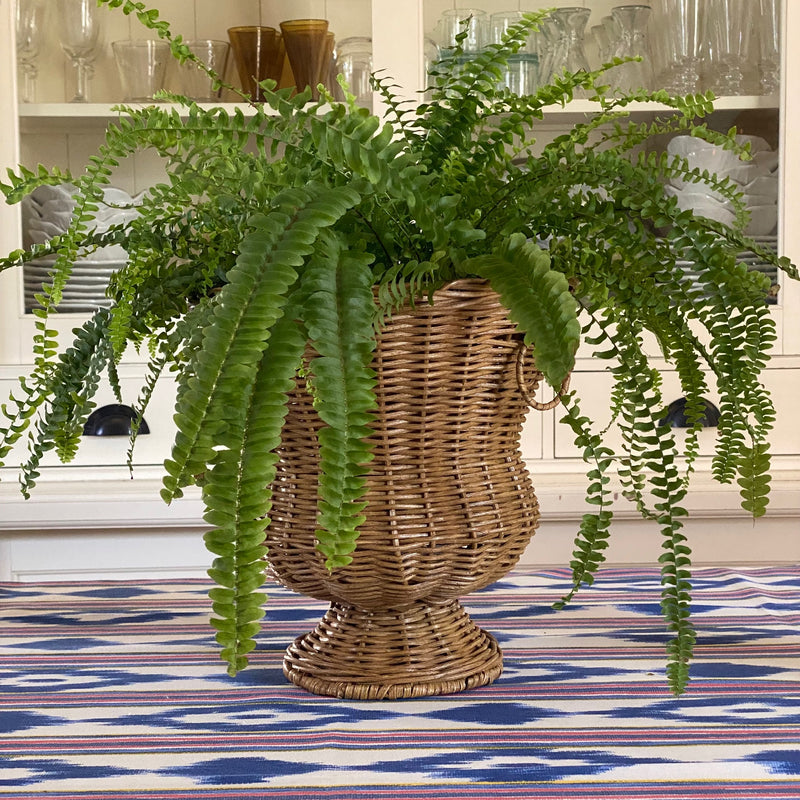 The Voyage Dubai - Handwoven Rattan Medici Vase designed by Mith.cph.  A beautifully crafted piece, made entirely by hand in Indonesia, inspired by the iconic Medici vase.   Use to display plants or flowers or simply as a statement piece in your home.  Origin – Indonesia  Material - Rattan  Approximate Dimensions: 28 cm H x  28 cm Diameter