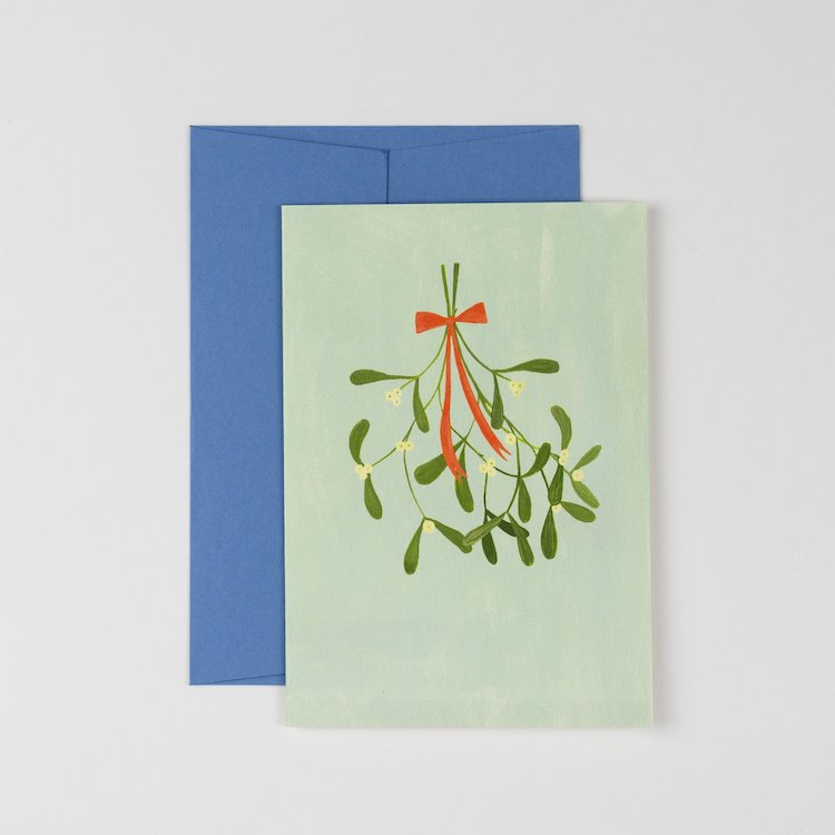The Voyage Dubai - Mistletoe Christmas Card   Originally hand illustrated by British artist Kate Cronk in watercolour and gouache.  Printed on luxury 300gsm card with a corresponding blue envelope.  Blank inside for your own message.  A6 size 148x105mm.  Designed and printed in the U.K.