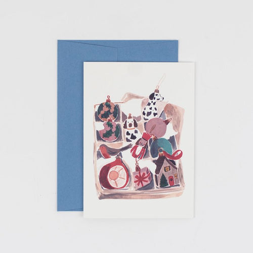 The Voyage Dubai - Vintage Ornaments Christmas Card   Originally hand illustrated by British artist Kate Cronk in watercolour and gouache.  Printed on luxury 300gsm card with a corresponding blue envelope.  Blank inside for your own message.  A6 size 148x105mm.  Designed and printed in the U.K.
