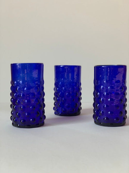 The Voyage Dubai - Handblown Syrian Recycled Bubble Tumbler (Cobalt Blue) Beautiful, whilst adding an element of fun, coloured glass is having a moment in the spotlight and we absolutely love these bubble tumblers, individually hand-crafted by talented artisans in Syria.