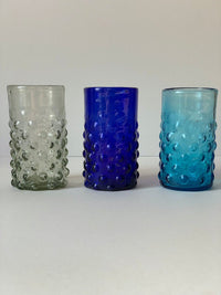 The Voyage Dubai - Handblown Syrian Recycled Bubble Tumbler (Cobalt Blue) Beautiful, whilst adding an element of fun, coloured glass is having a moment in the spotlight and we absolutely love these bubble tumblers, individually hand-crafted by talented artisans in Syria.