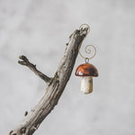The Voyage Dubai - Ceramic Christmas mushroom ornaments - Penny Bun (Brown)  The most charming ornaments perfect for the holiday season, these Christmas mushrooms make for a fun and quirky addition to the Christmas tree or holiday table.