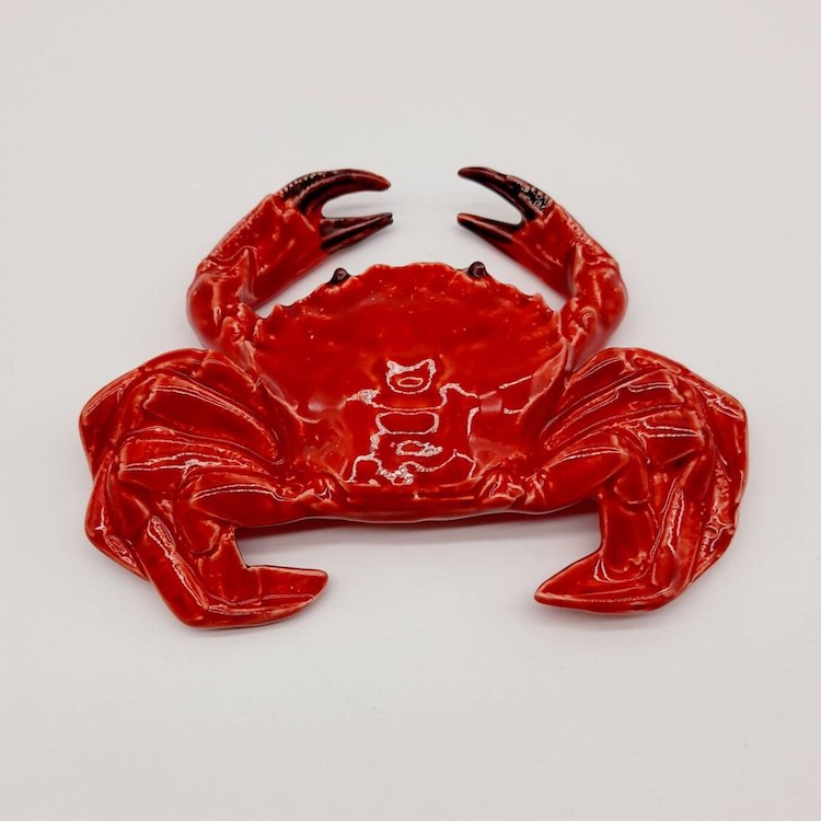 The Voyage Dubai - A lovely decorative piece, designed to be hung on the wall or simply placed on a table or desk, these ceramic crabs are handmade in a small workshop in the centre-west of Portugal. The design reflects the style of the Caldas da Rainha ceramics, home of the famous ceramicist Bordallo Pinheiro.  Full of character, the detail and workmanship is exquisite.  Approximate measurements: 17 x 13 cm  Sold individually, the crabs come with holes for hanging. 