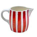 The Voyage Dubai - Milk Jug in Red Stripes  Handmade and hand painted in Malta in contemporary thick stripes, designed to complement the rest of the Villa Bologna collection. The chunky bands of colour are as brilliant on their own as they are when paired with the scroll pattern and/or the Palm pieces.