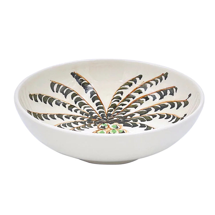 The Voyage Dubai - Peanut Bowl in Palm, 12cm  A recent addition to the Villa Bologna Pottery family, the Palm collection is designed to evoke the sunny spirit of the Mediterranean, whose islands are dotted with them. Mix-and-match the Palm with other designs for an informal look.  Handmade and hand painted in Malta.