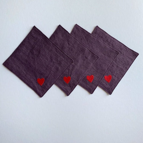 The Voyage Dubai - Seeing Hearts Cocktail Napkins in Plum (Set of 4) - A plum and red pairing with beautifully embroidered heart motifs. Great for any season, perfect for Valentine's -  Our cocktail napkins are handcrafted from 100% European linen that has been stonewashed and softened giving them a wonderful, luxurious feel. 